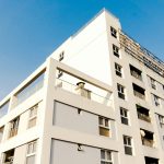 white concrete building under blue sky during daytime